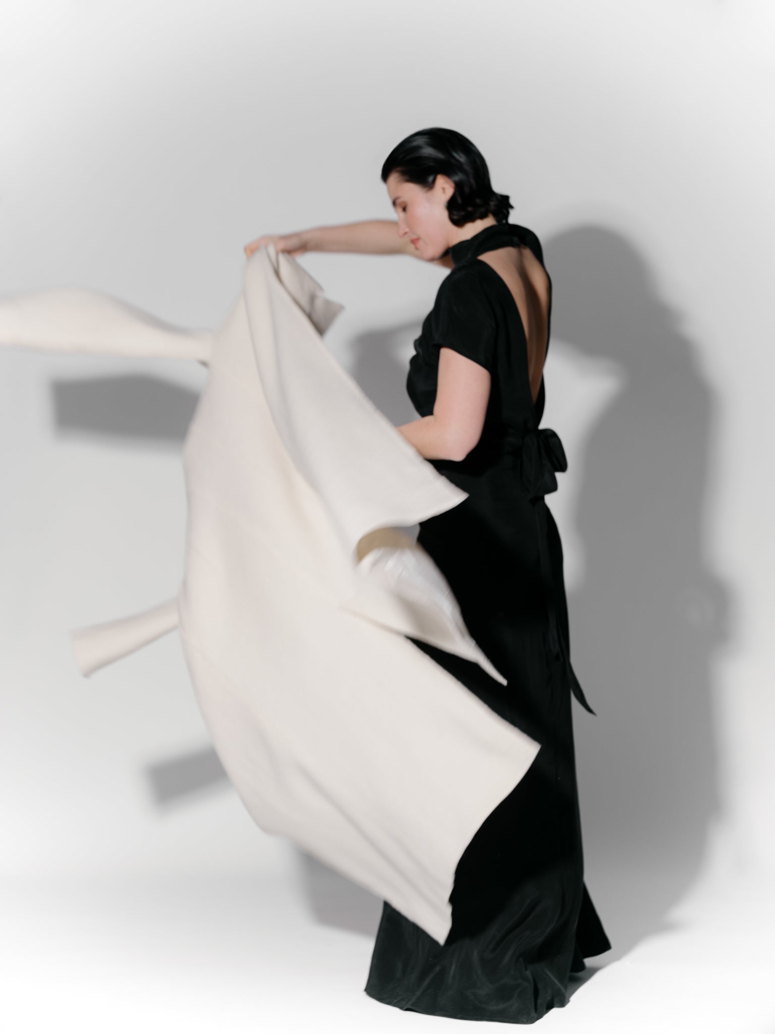 Model wearing Off-white boiled wool long coat by Zamsee—timeless, warm, and consciously crafted.