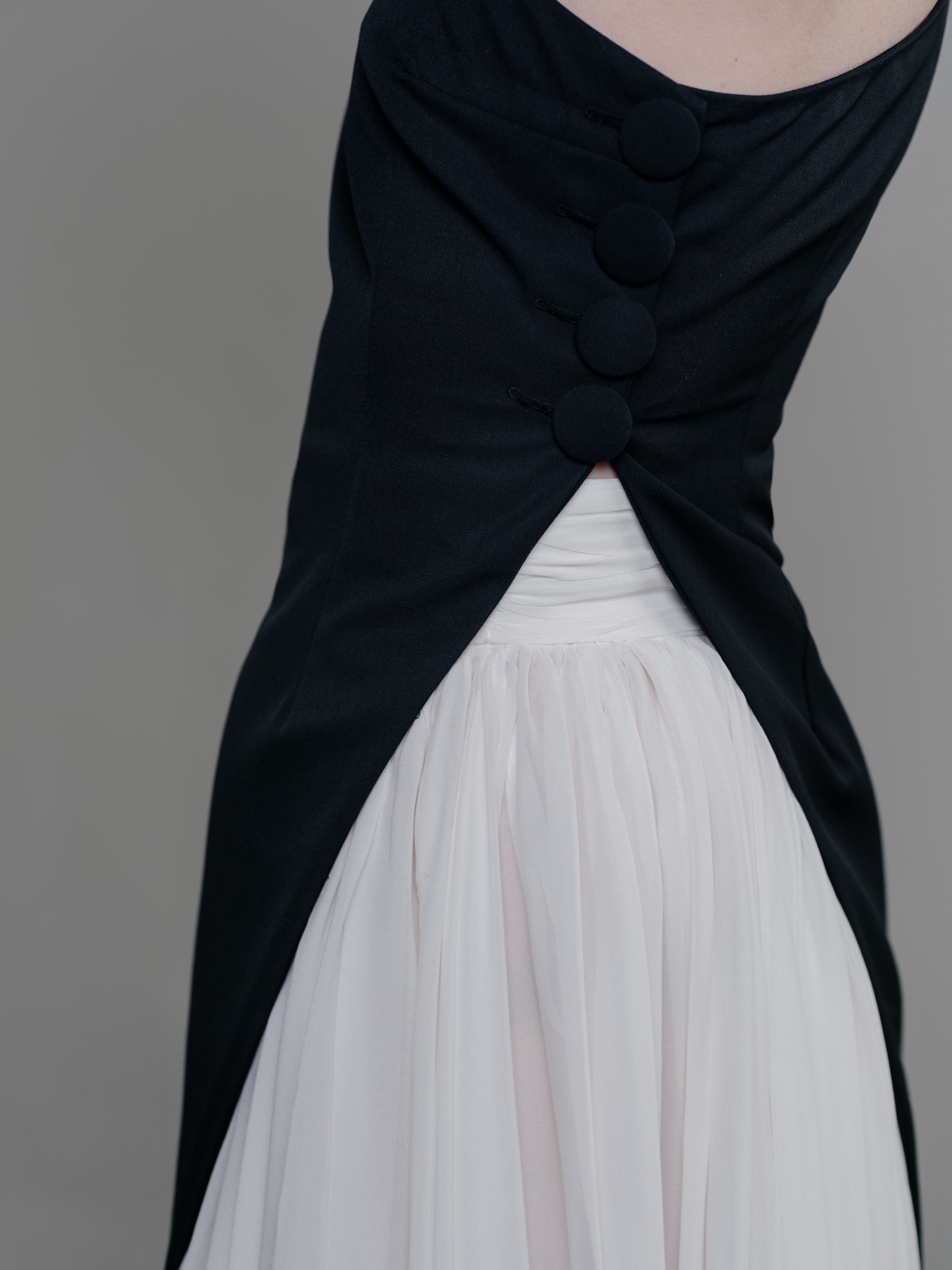 Wool Asymmetric Vest - Black by Zamsee fabric covered buttons detail